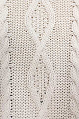 Cable knitted sweater texture close-up