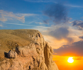 mountain cliff at the dramatic sunset