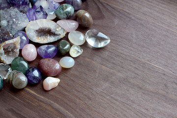 Semi-precious stones of different colors. Amethyst and amethyst druse crystals, rose quartz, agate,...