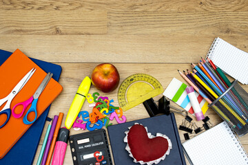 Back to school concept - pencil-box and books, notebooks and sticky note and calculator with pins,...