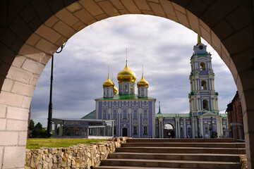 Tula, Russia - July 19, 2022. Assumption Cathedral and bell tower. View through the arch of the Kremlin wall - 524554638