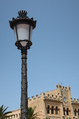 Fototapeta na wymiar Ciutadella, Menorca (Minorca), Spain. Town Hall building in Ciutedella de Menorca. Ornamental light in the front