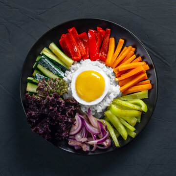 Close-up Of Korean Dish, With Variety Of Appetizers With Vegetables And Eggs. Diet. Bibimbap. Top View. Round Plate.