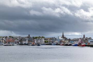 Naklejka premium 18 August 2022. Stornoway, Isle of Lewis, Highlands and Islands, Scotland. This is a scene of Stornoway Harbour on an August morning as rain clouds started to break up.