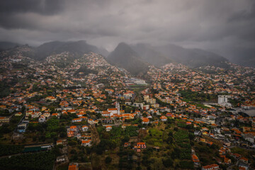 Aerial panoramic view of Funchal city, Madeira, Portugal in foggy and rainy weather. October 2021