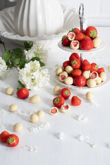  white chocolate covered strawberries, fresh strawberries and white floweers