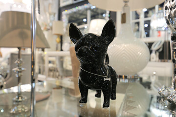 Black dog chihuahua sculpture on the table