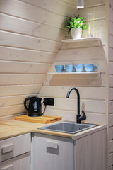 Faucet and sink in the kitchen interior