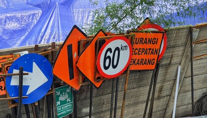 Construction signs that have been fabricated but not yet installed on the construction site.