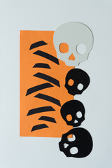 paper skulls and orange paper with short black stripes