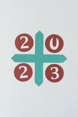 sign with the year 2023 - arranged on a green cross shape