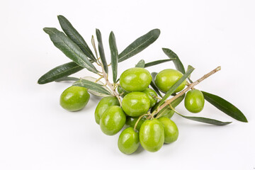 Green fresh olives on the white background