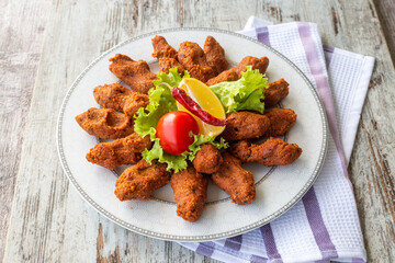 Traditional delicious Turkish food; Turkish name; Cig kofte (raw meatball in Turkish) with lettuce