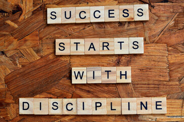 success stars with discipline text on wooden square, motivation and inspiration quotes