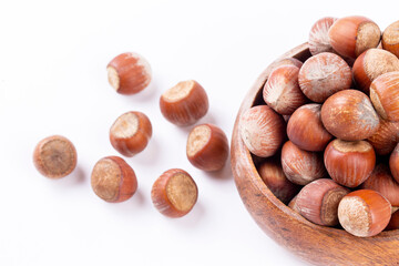 Shelled hazelnuts on the white background