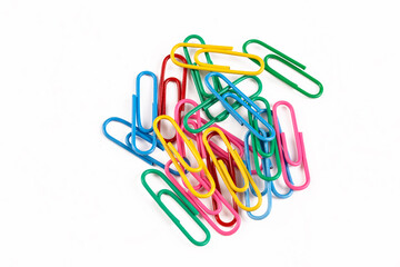 Colored paper clips on the white background
