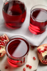 Freshly made pomegranate juice on light table
