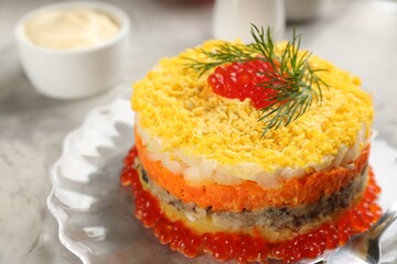 Traditional russian salad Mimosa on table, closeup