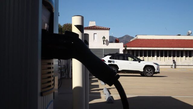 Frame Slowly Lowers on Generic EV SUV at Charging Port