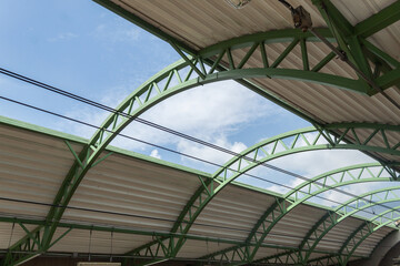 Internal structure of a metro station that allows to see the blue sky in the middle.