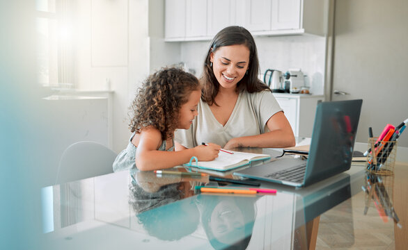 Mother helping her girl with writing her homework of a happy family house in her creative kids notebook. Mom, education and smart school student studying and distance learning with her young parent