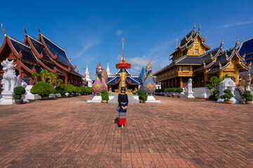 Asian traveller women wearing traditional clothes at beautiful Wat Ban Den Temple is a famous place...
