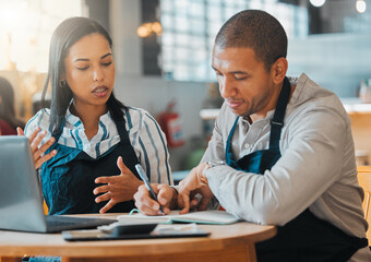 Small business owners discussing and planning startup growth, budget and expenses in the cafe or...