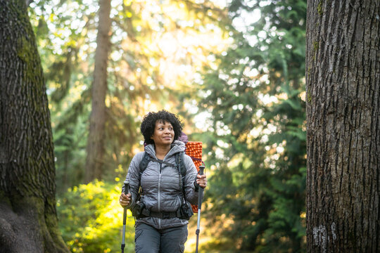 U.S. Army female soldier putting in the miles with an early morning hike in the NorthWest.