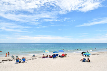 Families enjoying a warm, sunny day at Vero Beach, Florida on Hutchinson Island