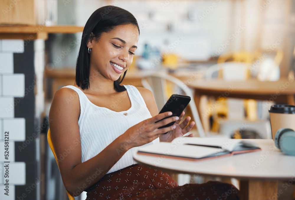Poster texting a message or browsing social media on a phone by a young female student sitting in a coffee 