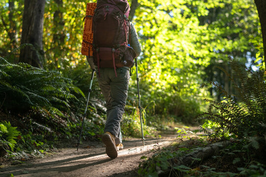 U.S. Army female soldier putting in the miles with an early morning hike in the NorthWest.