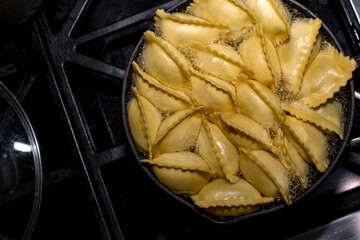ravioli cooking in a pot 