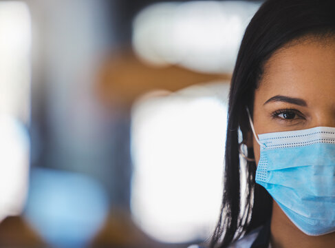 Covid, mask and portrait of doctor, nurse or medical healthcare worker wearing surgical mask to protect against the coronavirus. Closeup, safety and protection of health during pandemic in hospital.
