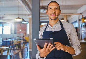 Restaurant entrepreneur with tablet, leaning on door and open to customers portrait. Owner, manager or employee of a startup fast food store, cafe or coffee shop business standing happy with a smile - obrazy, fototapety, plakaty