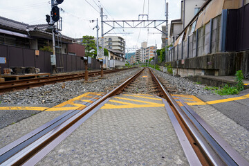 Local train roadway and grade crossing in Uji, Kyoto, Japan
