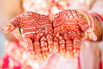 Beautiful henna design on the hand of a Hindu bride on her wedding eve.