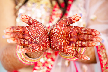 Beautiful henna design on the hand of a Hindu bride on her wedding eve.