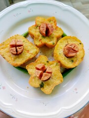 indonesian fried snack called tahu fantasi on white plate