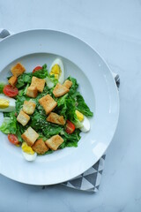 a plate of salad in white background