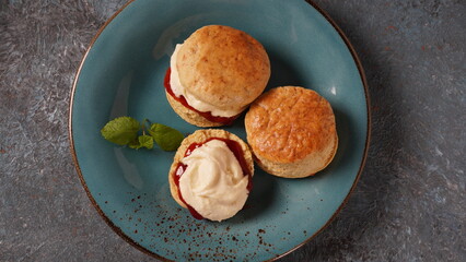 British scones with fruit jam and whipped cream
