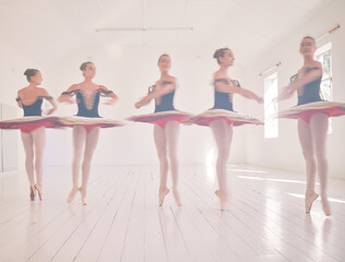 Fototapeta premium Ballet dancers, fitness and women training, learning and dancing at an open studio hall space. Healthy, workout and talented ballerina girls with energy, jumping and balance to master a creative art