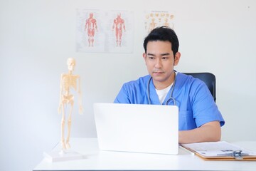 doctor working on laptop