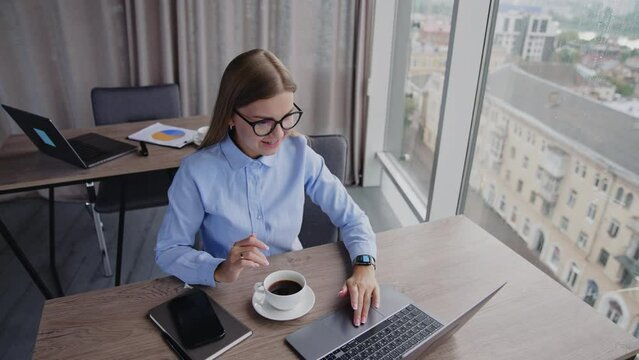 European focused businesswoman concept. Successful young business famele manager typing on smartphone.