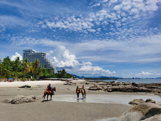 Horse rinding for tourists on the beach of Hua Hin, Thailand.