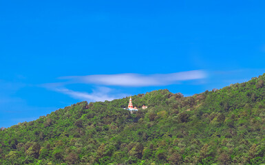Fototapeta na wymiar Buddha temple nestled in the Mountains of Patong Phuket Thailand