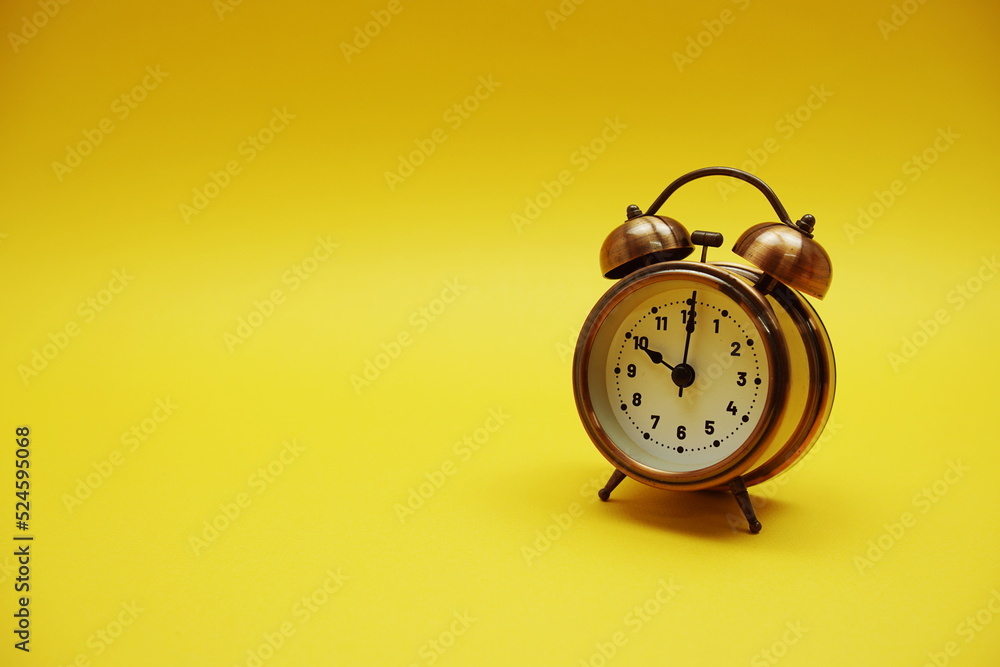 Poster alarm clock with space copy on yellow background