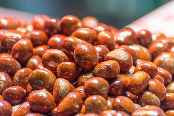 Candied fried chestnuts at a street food stall