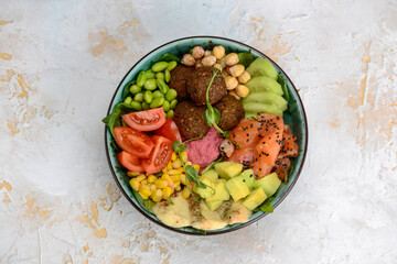 breakfast with salmon falafel and vegetables
