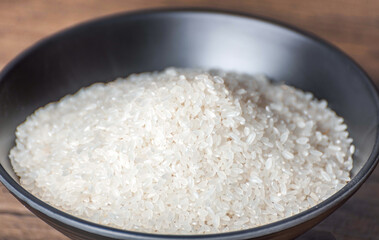 Oats, rice in bamboo baskets, wooden spoons, bowls, rice jars