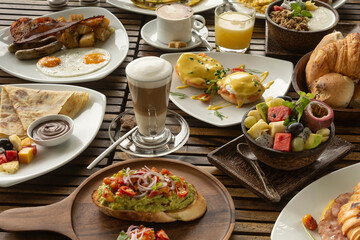 many mixed western breakfast food items on cafe table - 524603400